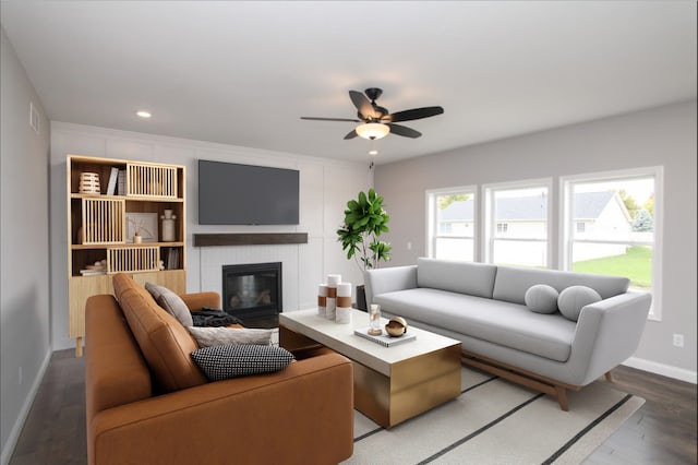 living room featuring hardwood / wood-style flooring and ceiling fan