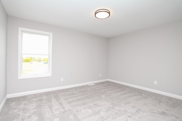 empty room with carpet flooring