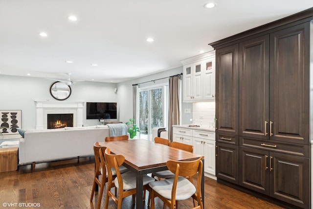 dining area with dark hardwood / wood-style flooring