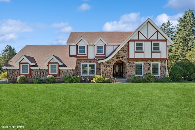 tudor house featuring a front lawn