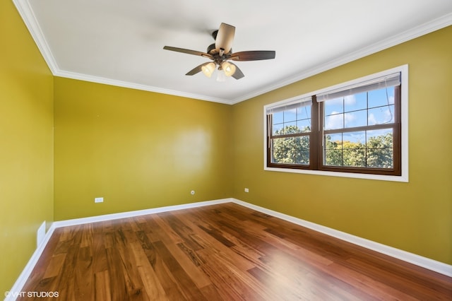 empty room featuring crown molding, hardwood / wood-style floors, and ceiling fan