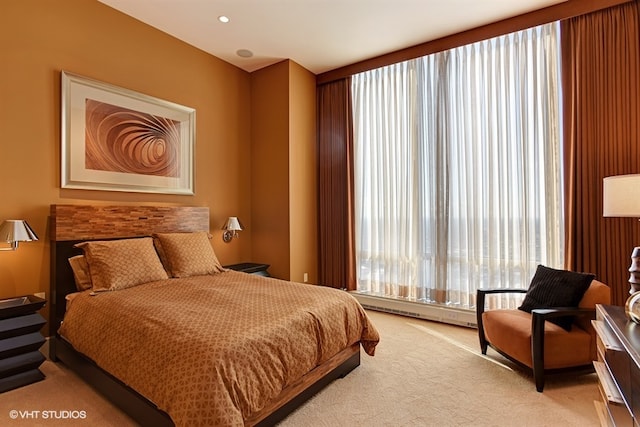 bedroom featuring light colored carpet