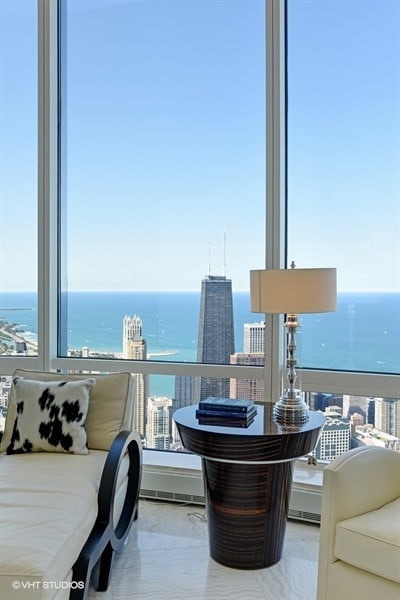 view of patio featuring a water view and a balcony