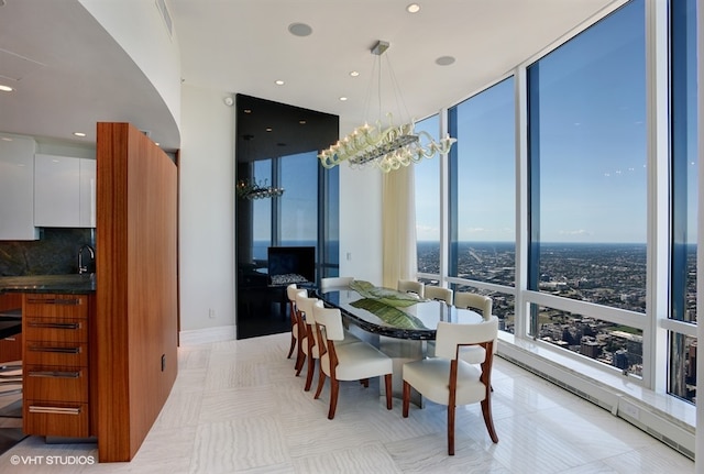 tiled dining room with an inviting chandelier and expansive windows