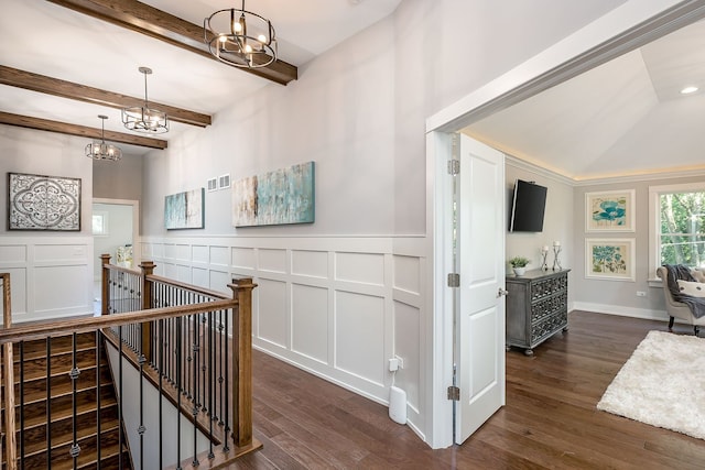 corridor featuring an inviting chandelier, vaulted ceiling with beams, and dark hardwood / wood-style floors