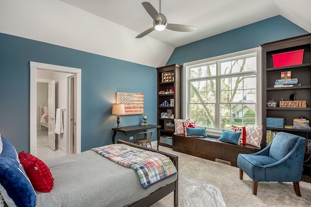 carpeted bedroom featuring vaulted ceiling and ceiling fan