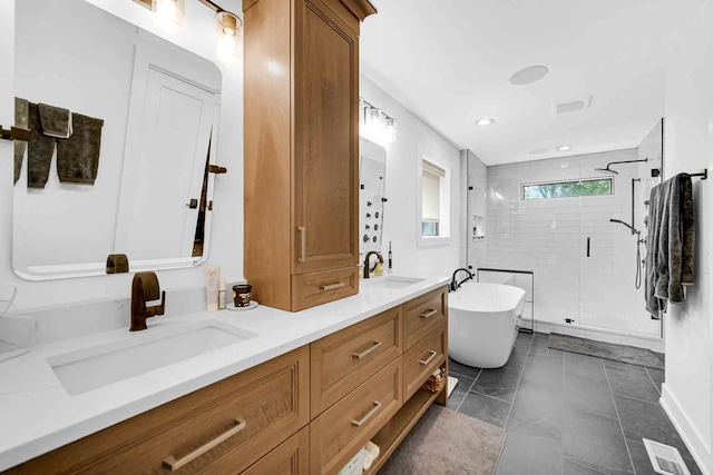 bathroom with dual vanity, tile floors, and separate shower and tub