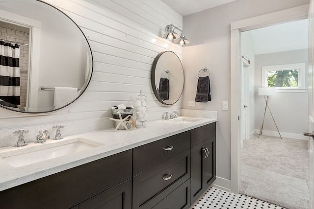 bathroom featuring double vanity and tile floors