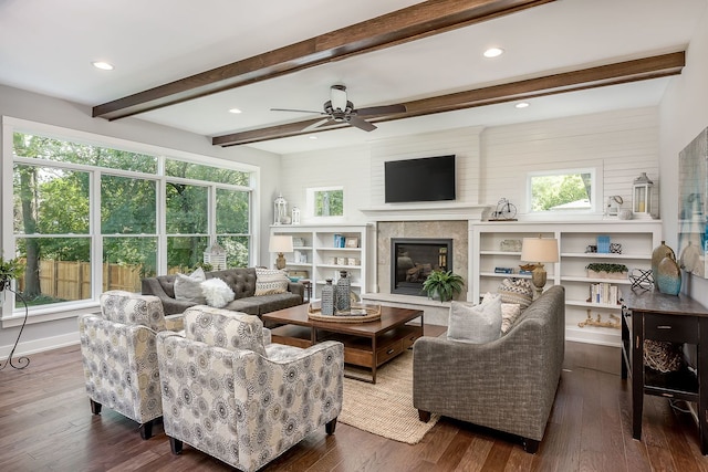 living room with beamed ceiling, ceiling fan, and dark hardwood / wood-style flooring