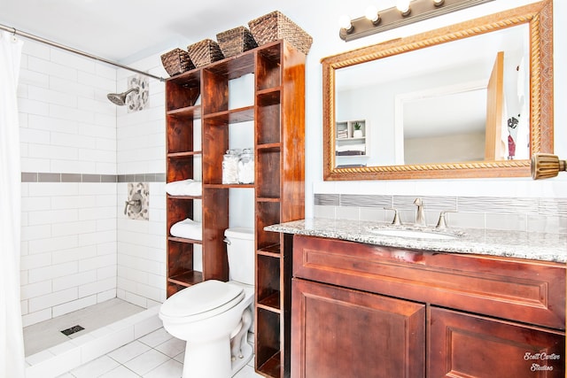 bathroom with curtained shower, toilet, vanity, tile patterned flooring, and tasteful backsplash