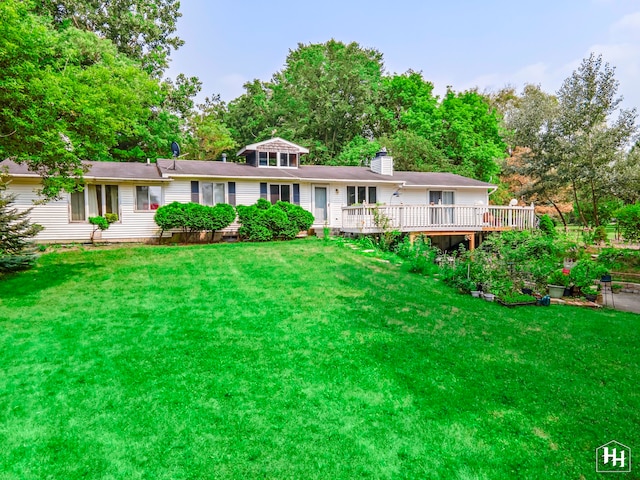 view of front of home with a front lawn and a deck