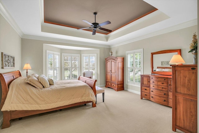 3001 E Stone Creek Blvd, Urbana, IL 61802 - bedroom featuring a tray ceiling, crown molding, light colored carpet, and a ceiling fan
