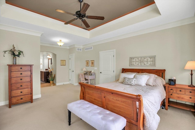 3001 E Stone Creek Blvd, Urbana, IL 61802 - bedroom featuring ornamental molding, a raised ceiling, arched walkways, light colored carpet, and a ceiling fan