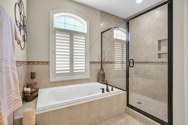 3001 E Stone Creek Blvd, Urbana, IL 61802 - bathroom featuring a jetted tub, a shower stall, and tile patterned floors