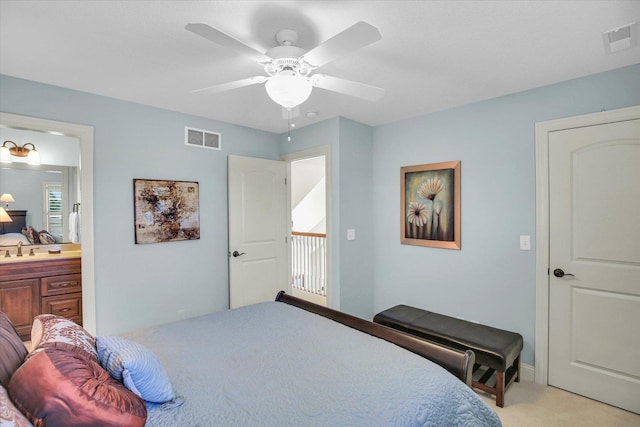 3001 E Stone Creek Blvd, Urbana, IL 61802 - bedroom featuring light colored carpet, ensuite bath, and a ceiling fan