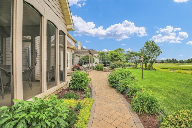 3001 E Stone Creek Blvd, Urbana, IL 61802 - view of green lawn featuring a patio area and a pergola