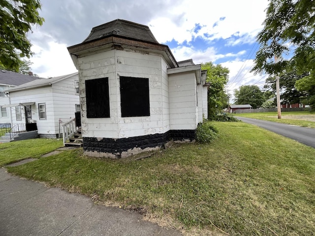 view of property exterior featuring a yard