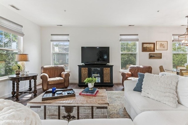 33 Johnson Ct Unit 0, North Aurora, IL 60542 - living area featuring a chandelier and wood finished floors