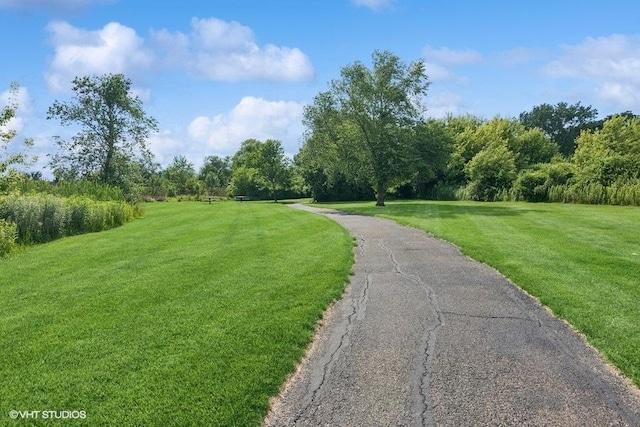 33 Johnson Ct Unit 0, North Aurora, IL 60542 - view of home's community featuring a lawn