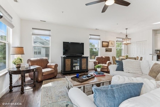 33 Johnson Ct Unit 0, North Aurora, IL 60542 - living room featuring wood finished floors, a chandelier, and a ceiling fan