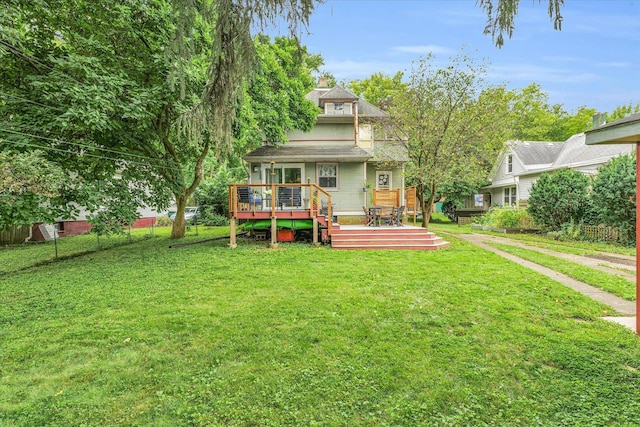 rear view of property with a wooden deck