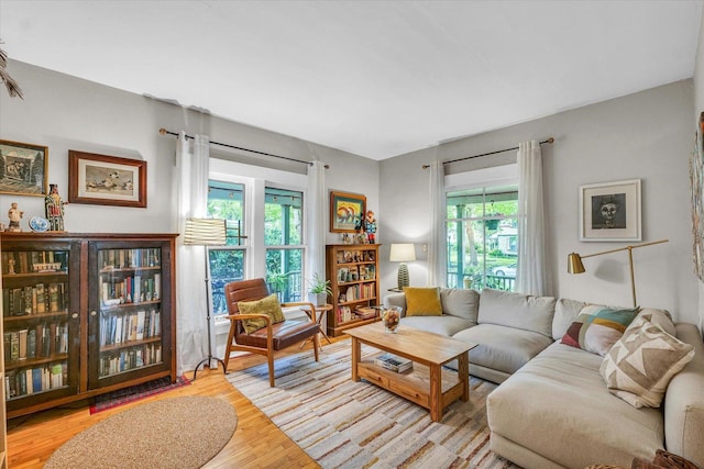 living area featuring plenty of natural light and wood finished floors
