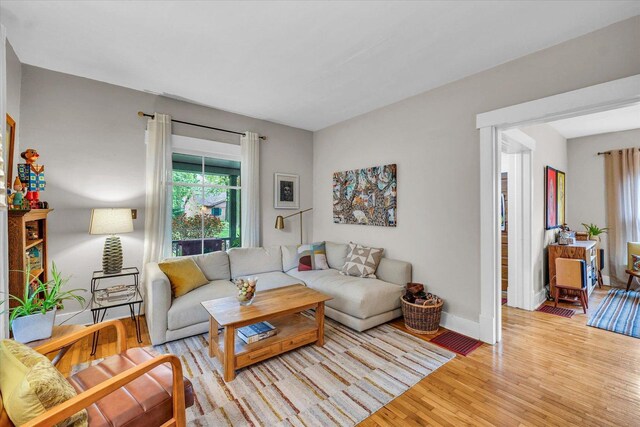 living room with wood finished floors and baseboards