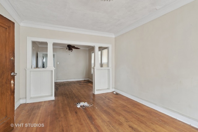 unfurnished room with ceiling fan, a textured ceiling, crown molding, and wood-type flooring