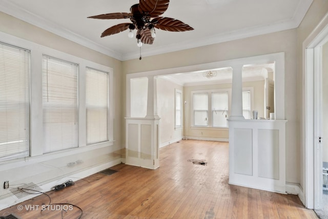 interior space featuring light wood-type flooring and crown molding