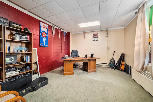 office area with carpet flooring, a baseboard heating unit, and a paneled ceiling