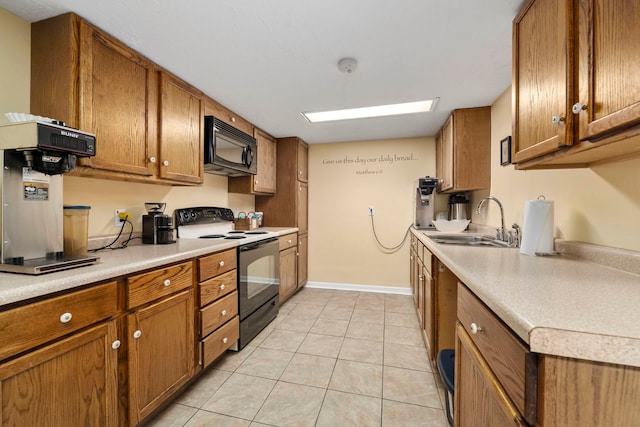 kitchen with electric range, sink, and light tile flooring