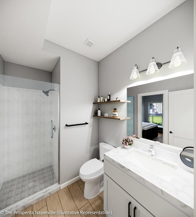 bathroom featuring vanity, toilet, and a shower with door