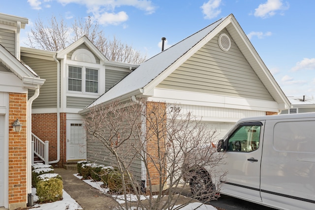 view of side of property featuring a garage