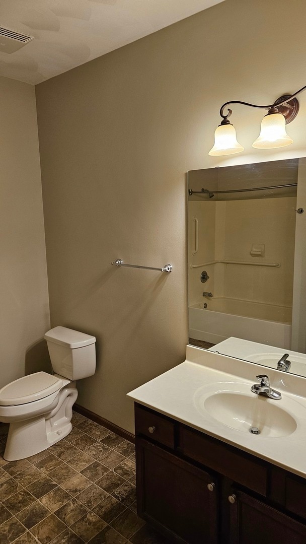 full bathroom featuring vanity, toilet, and shower / bath combination