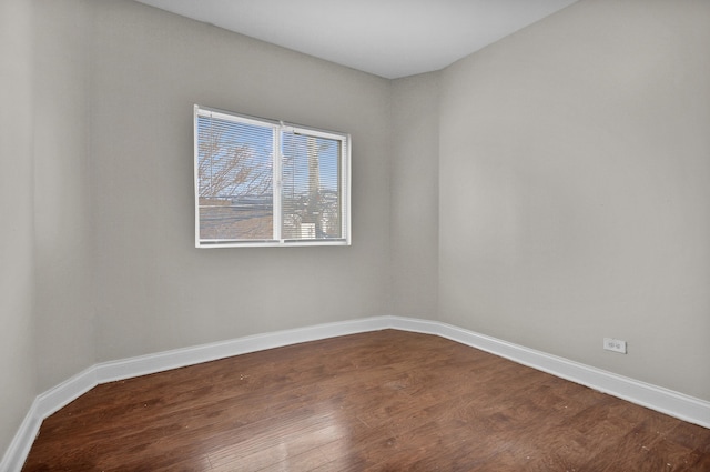 empty room featuring dark hardwood / wood-style flooring