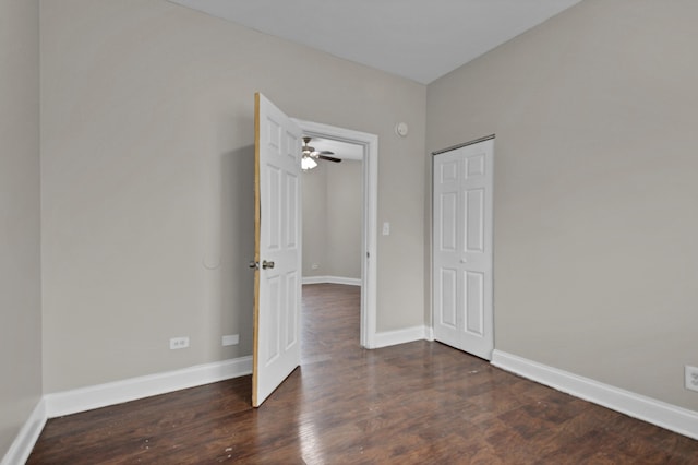 unfurnished bedroom featuring dark wood-type flooring