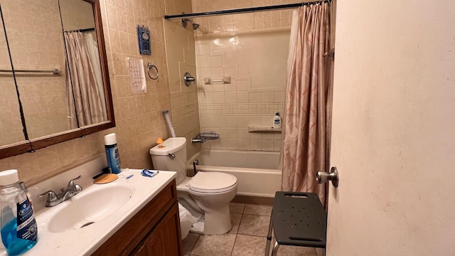 full bathroom with toilet, tile walls, tile patterned floors, shower / bath combo, and vanity