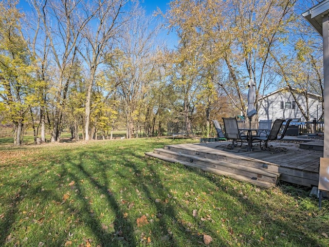 view of yard with a wooden deck