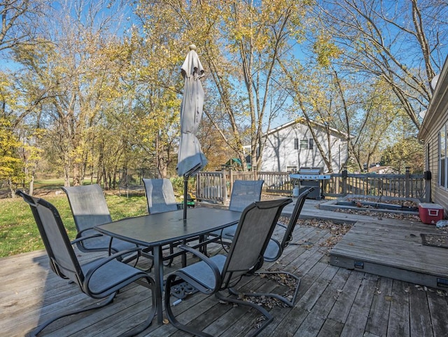 wooden deck with grilling area