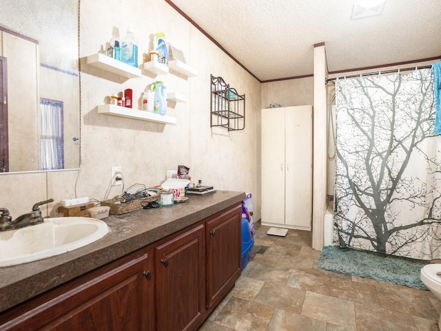 full bathroom with a textured ceiling, toilet, vanity, shower / tub combo, and ornamental molding