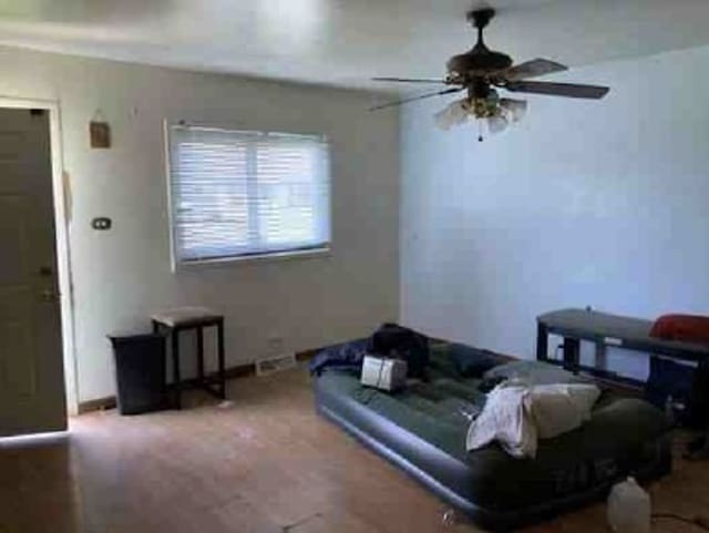 living room featuring ceiling fan