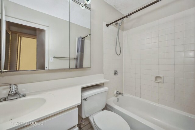 full bathroom featuring shower / bath combination with curtain, vanity, and toilet