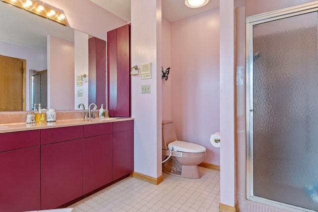 bathroom with tile patterned floors, vanity, toilet, and an enclosed shower