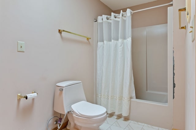 bathroom with toilet and shower / bath combo