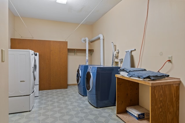 clothes washing area with independent washer and dryer