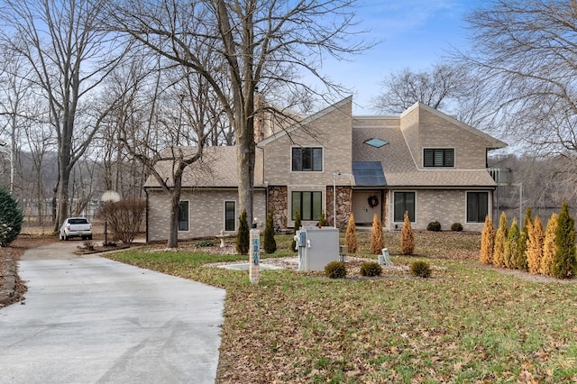 1210 Lakeridge Ct, Danville, IL 61832 - view of front facade with concrete driveway, brick siding, and a shingled roof