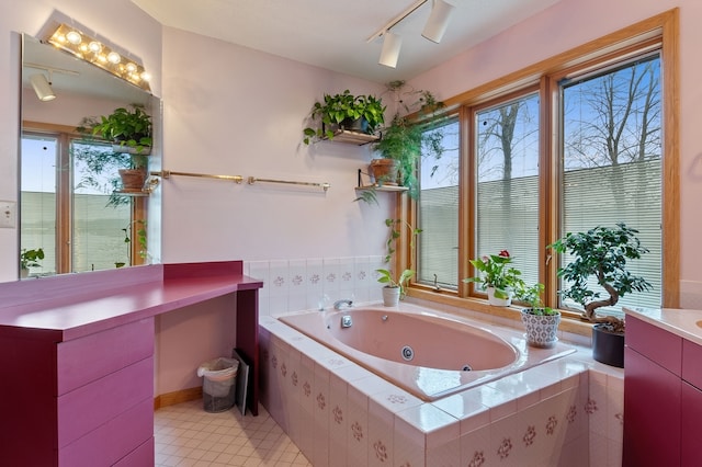 bathroom featuring vanity, tile patterned flooring, independent shower and bath, and rail lighting