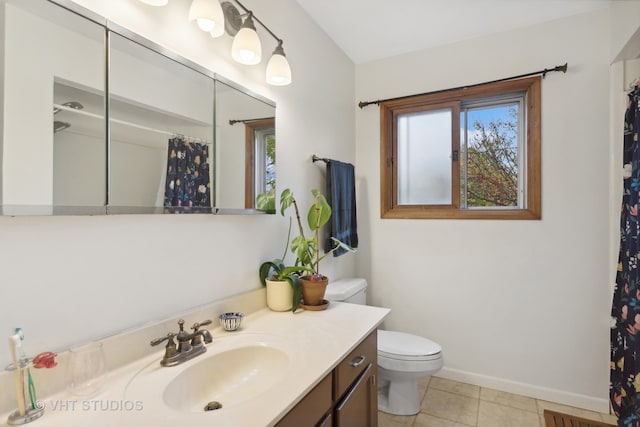 bathroom with tile patterned floors, toilet, and vanity