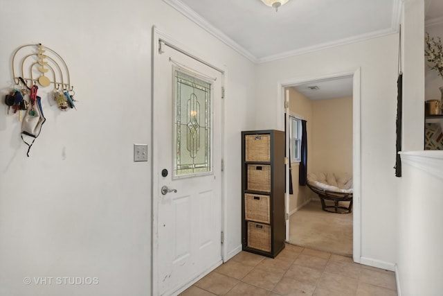 tiled foyer featuring crown molding