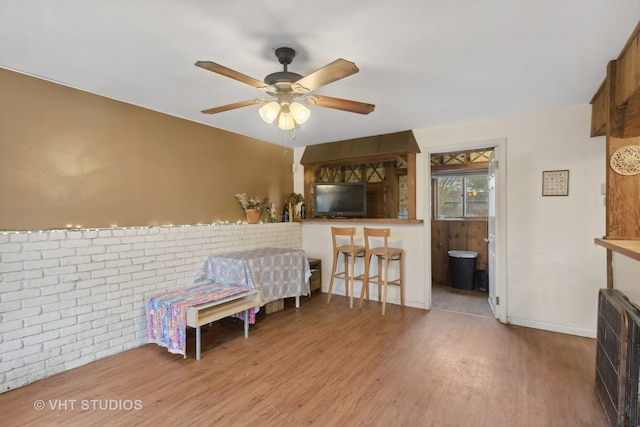 bedroom featuring ensuite bathroom, ceiling fan, and hardwood / wood-style floors